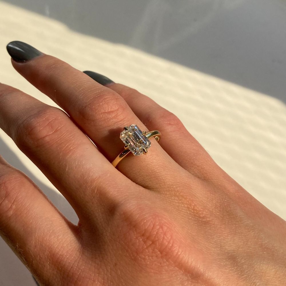 Compass Setting Emerald Cut Diamond Engagement Ring On Finger2 